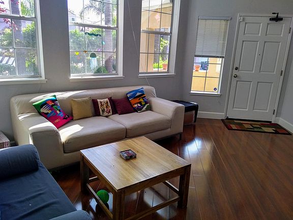 Main entry into living room with high ceilings