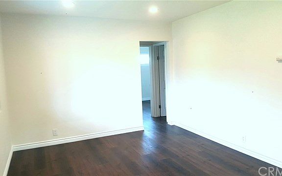 Spacious living room with brand new lighting and floors