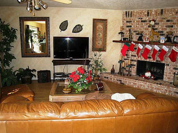 Very large family room with corner fireplace and nice mantel