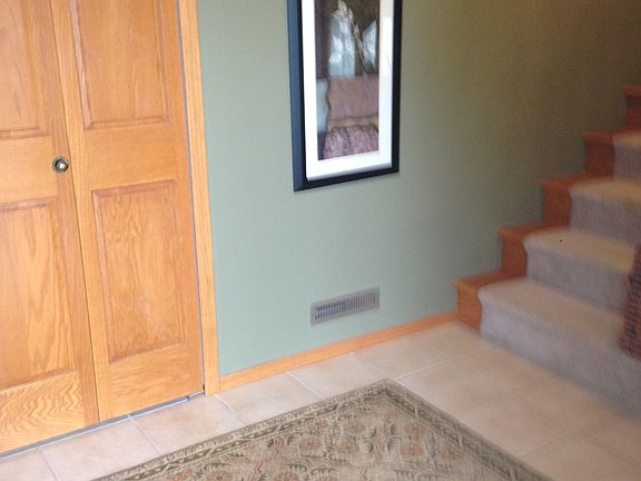 Tiled entrance, coat closet