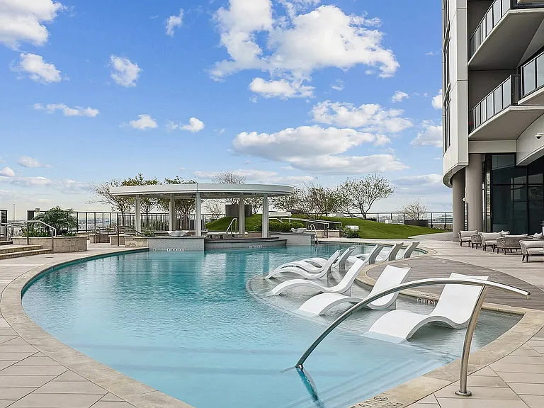 Resort-Style Pool with Relaxing Sun Shelf
