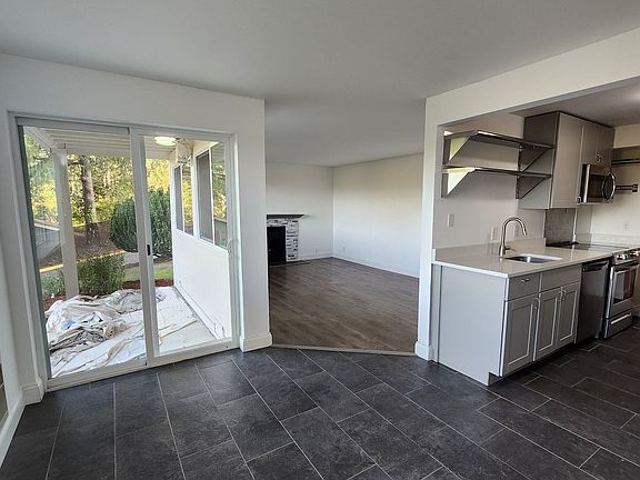 Eating area, kitchen and living room.