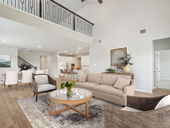 Virtually staged living room in the Beckley floorplan at a Meritage Homes community.