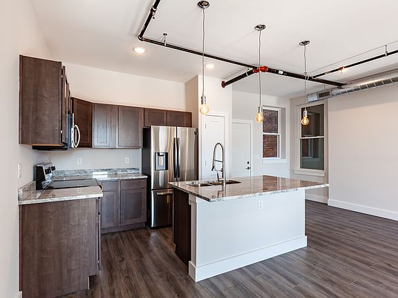 Spacious kitchen offers quality finishes. Hard wood cabinetry, granite and nice appliances.