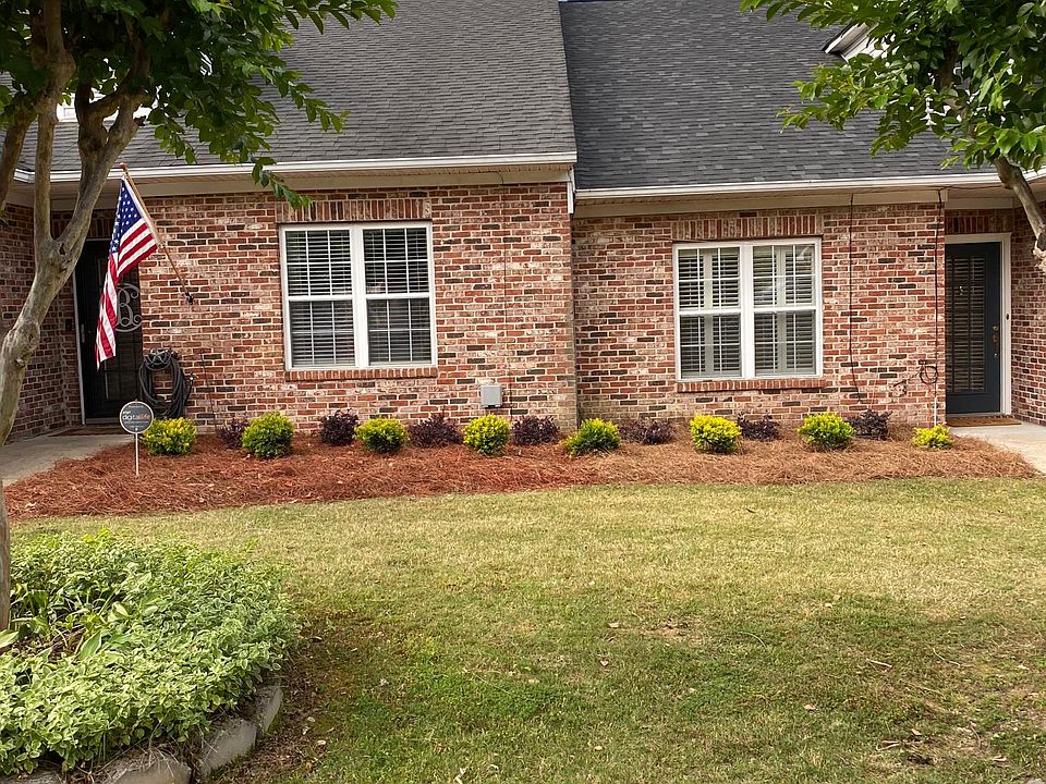 Front of townhome with newly planted landscaping