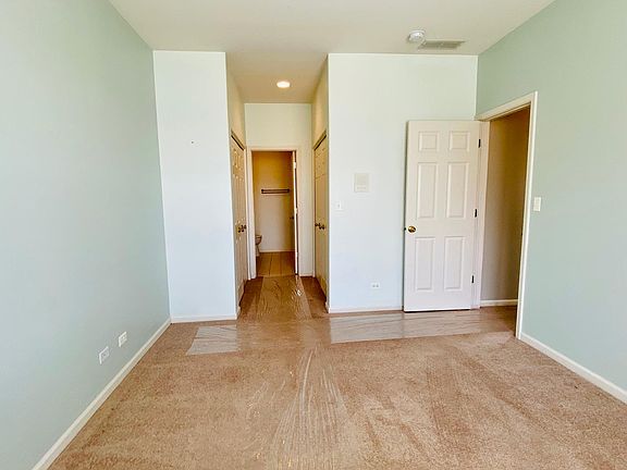 Master bedroom w/ 2 closets & private bathroom