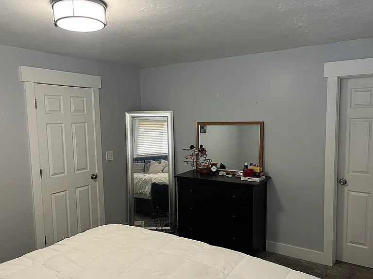 Primary bedroom, door on right leads to small master bathroom with shower, sink/toilet and 2 vanities