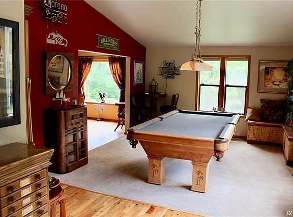 Large living room, pool room, etc.  off entry.