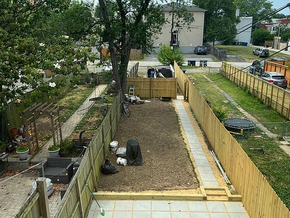 Backyard with new fencing; landscaping to be installed in September