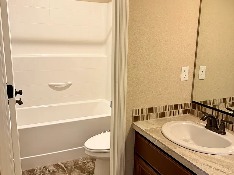 Guest Children's Bathroom. Equipped with a bathtub.