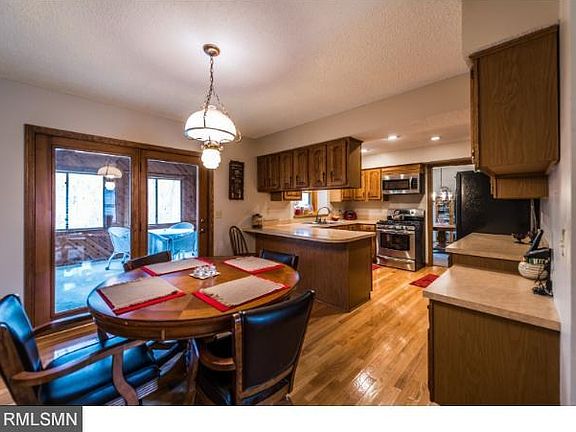 Informal dining off of kitchen, leading out into the four season family room