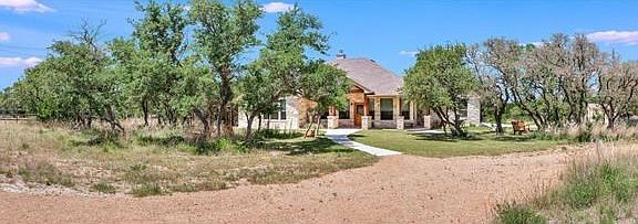 Home is perfectly situated on a corner cul-de-sac lot, with 1.61 fully fenced acres - replete with a