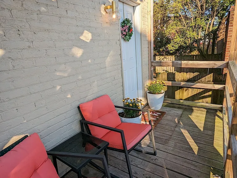 Small back deck and your private entrance. On the right, out of the photo, would be your parking.