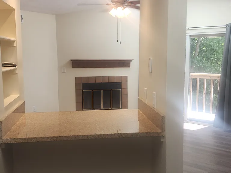 From kitchen looking through bar area to living room.