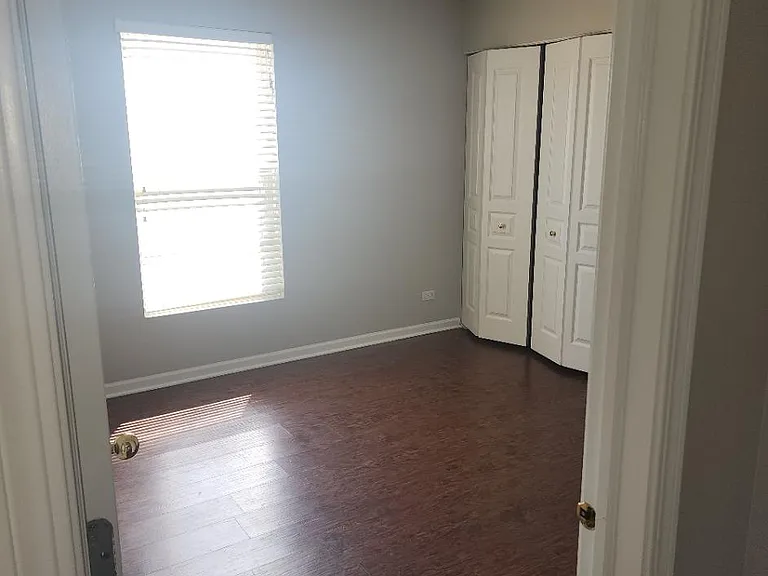 Freshly painted 2nd bedroom with ceiling fan