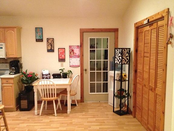 Kitchen door leads out to large back deck.