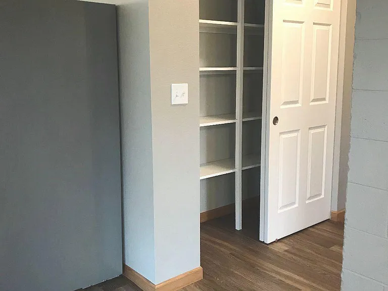 Large pantry and linen closet, with loads of storage space, is next to the kitchen. Coat closet is across the hall.