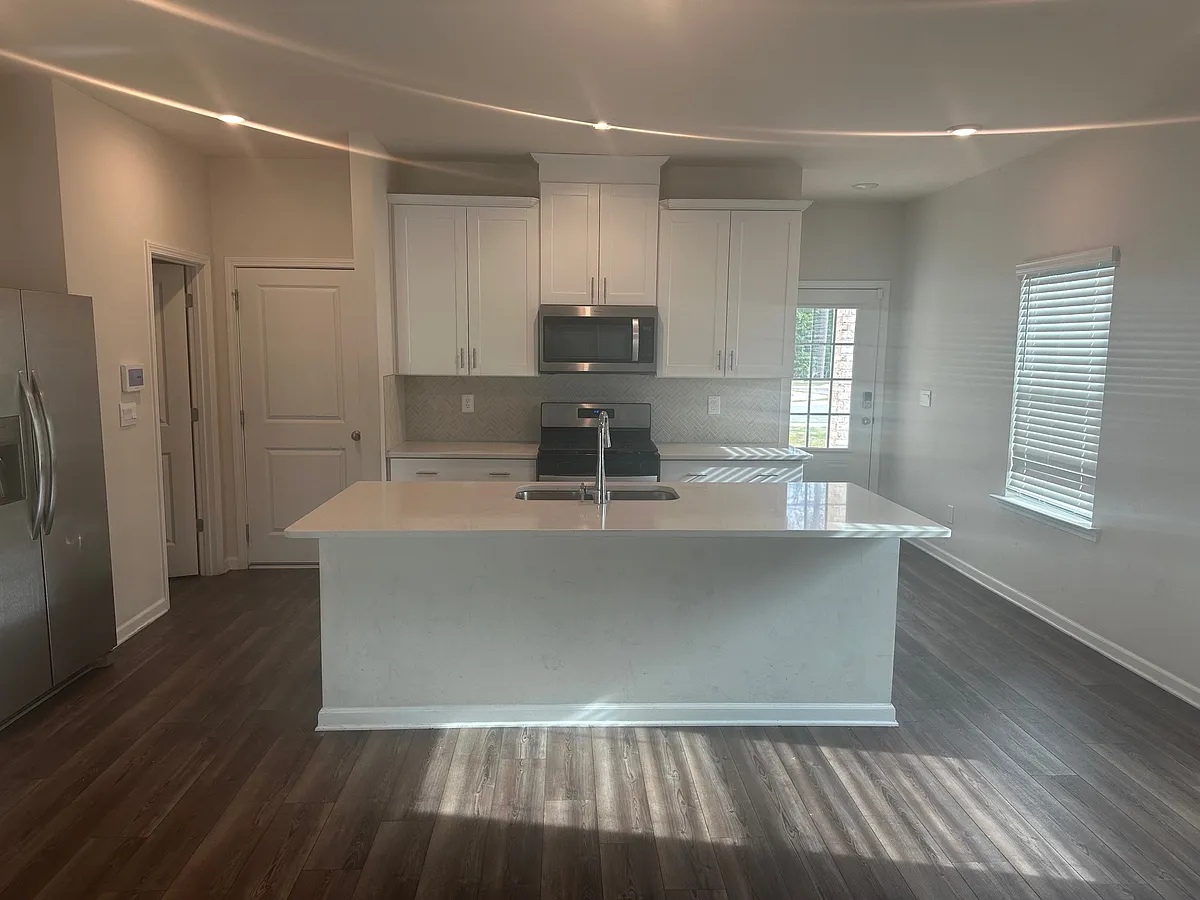A conveniently located half bath is on the first floor. - 1402 Villageside Ct