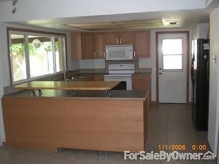 Kitchen w/ Butcher block Breakfast Bar
						:
						NEW Ikea Kitchen - Never used... Soft close cabinets & drawers.