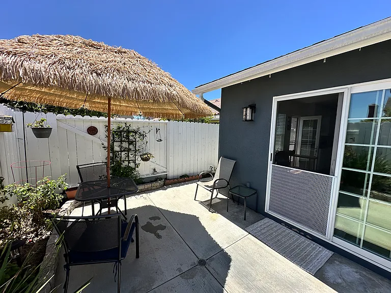 Patio Area and sliding glass door to unit