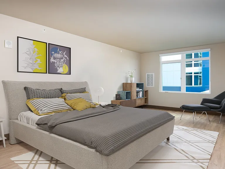 Large windows in the master bedroom provide plenty of natural light