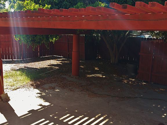 back yard w/ coverd patio