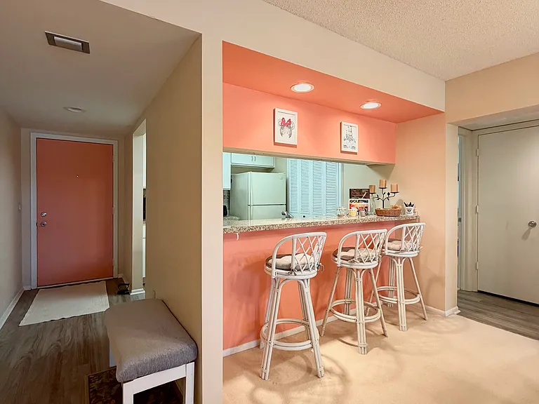 Entry foyer, kitchen w/ pantry & breakfast bar to enjoy morning coffees and stunning lake/golf course views!