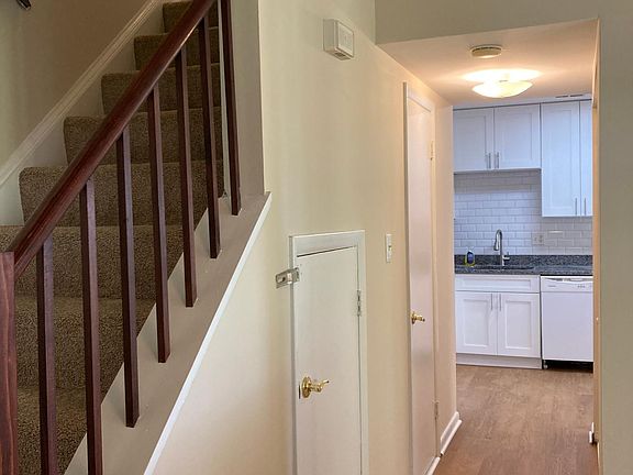 Entry hall way looking towards newly installed kitchen and stairway to upstairs