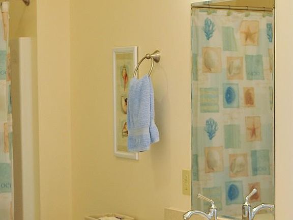 Bathroom with double sinks, shower tub 