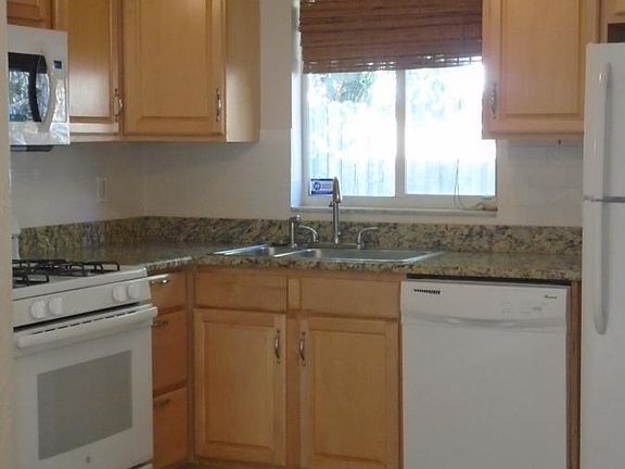 Kitchen with Solid Wood Cabinets and Granite Counter tops