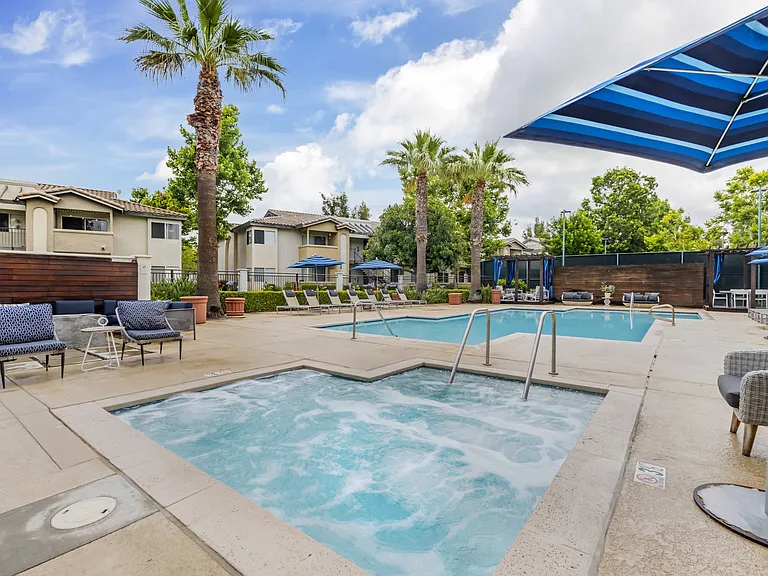The Summit's pool deck offers the perfect blend of relaxation and luxury with plenty of individual sunloungers and a beautiful on-site spaideal for unwinding after a long day.