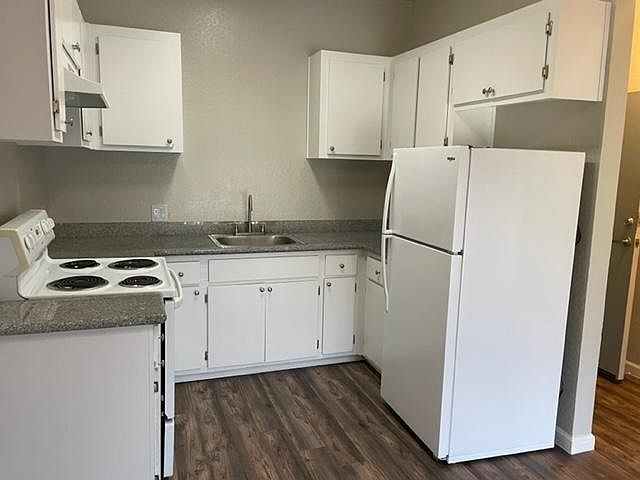 The Kitchen includes a Refrigerator, Electric Stove, Food Disposal, Real Granite Countertops, and Ample Cabinet Space.