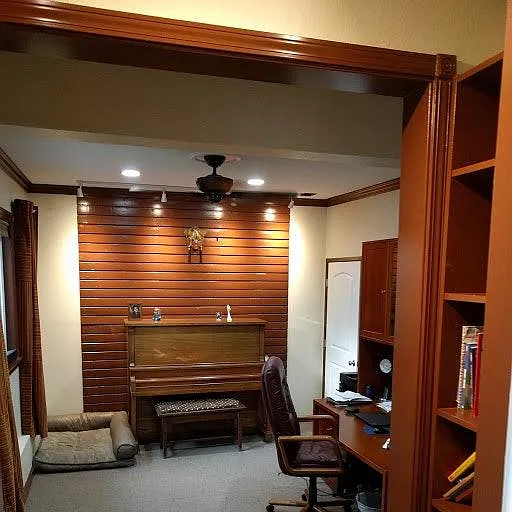 Office space with inbuilt wooden shelfs and 100+ years old authentic piano set.