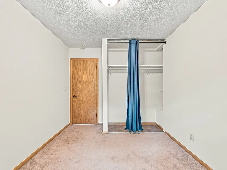 Bedroom #3 - third bedroom with hallway and rear-entry access