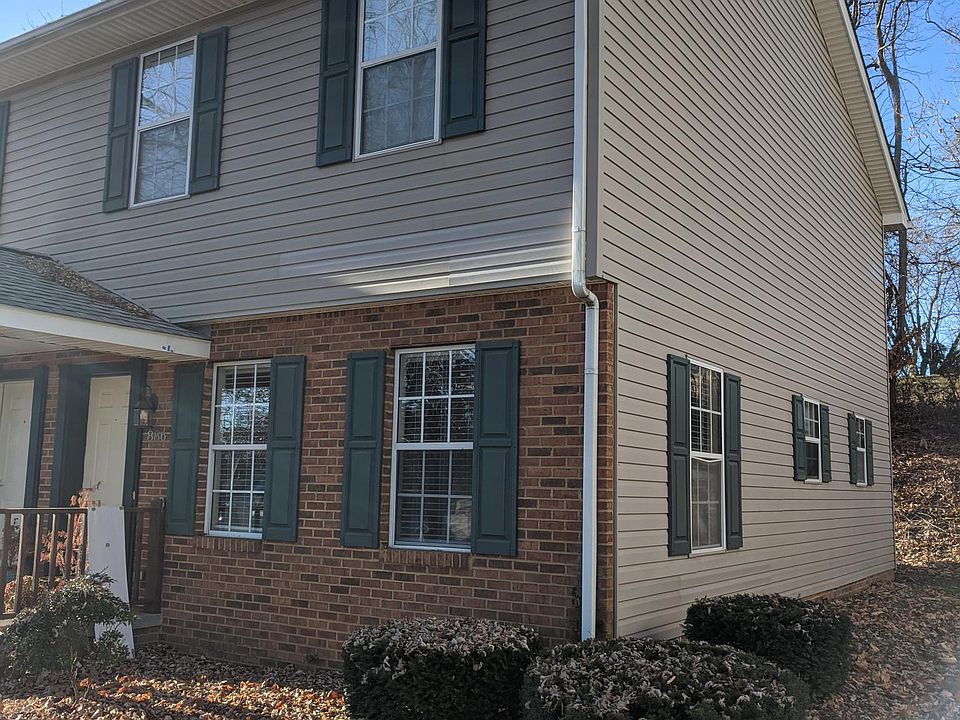 Front exterior (quieter, desirable end-unit with extra windows)