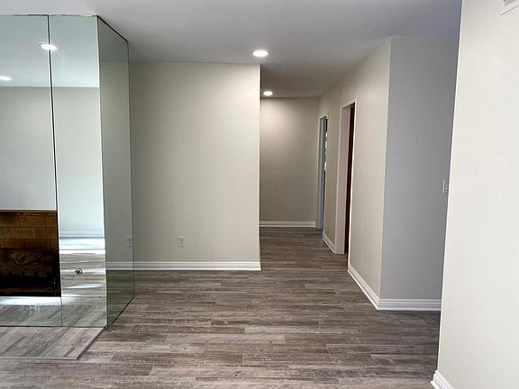 Hallway to the dining room, kitchen, and master bedroom