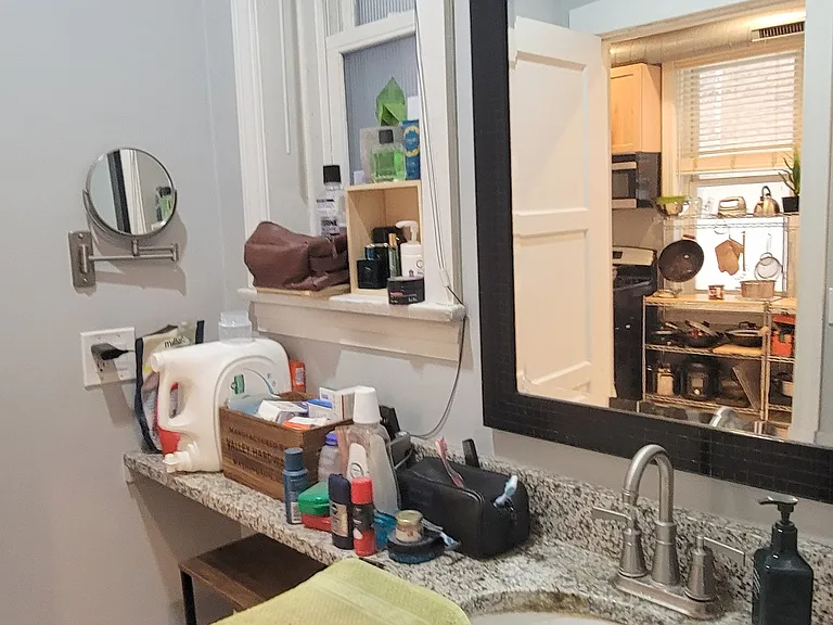 Beautiful bathroom fixtures, granite sink, window, exhaust vented outside, high end light fixtures and more...