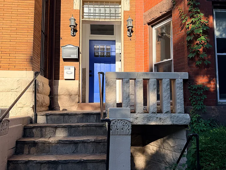 Front Doors of 2115 1st St. Unit B down the steps.