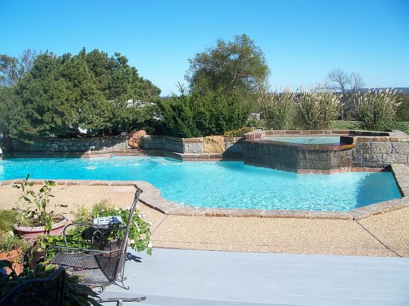 View of pool and hills beyond