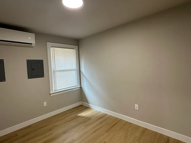 Bedroom #2. Large window radiates natural light.