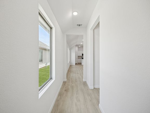 Entryway in the Cypress home plan by Trophy Signature Homes - REPRESENTATIVE PHOTO