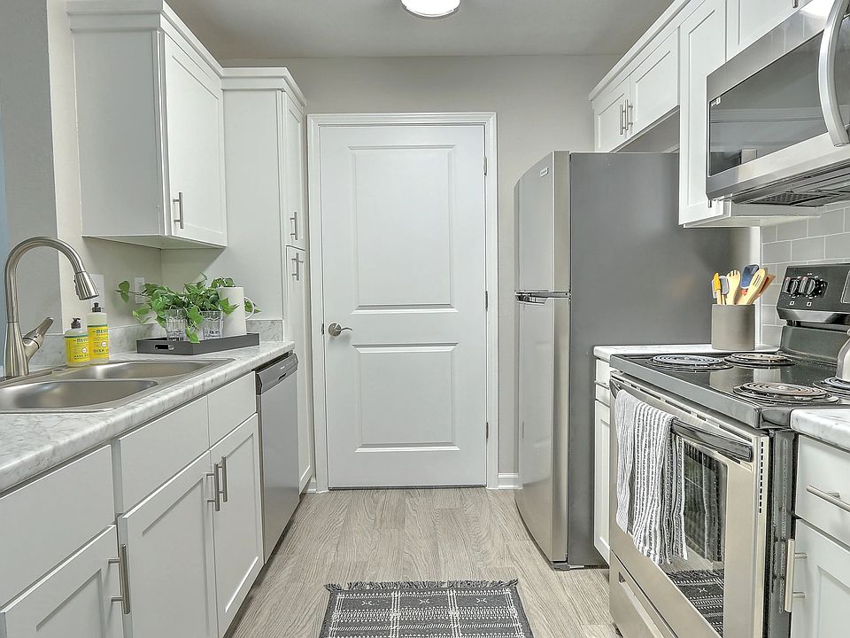 Discover designer kitchen elegance with ample storage in our updated kitchens.