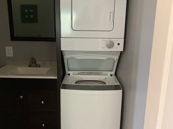 Washer/Dryer combo in bathroom.