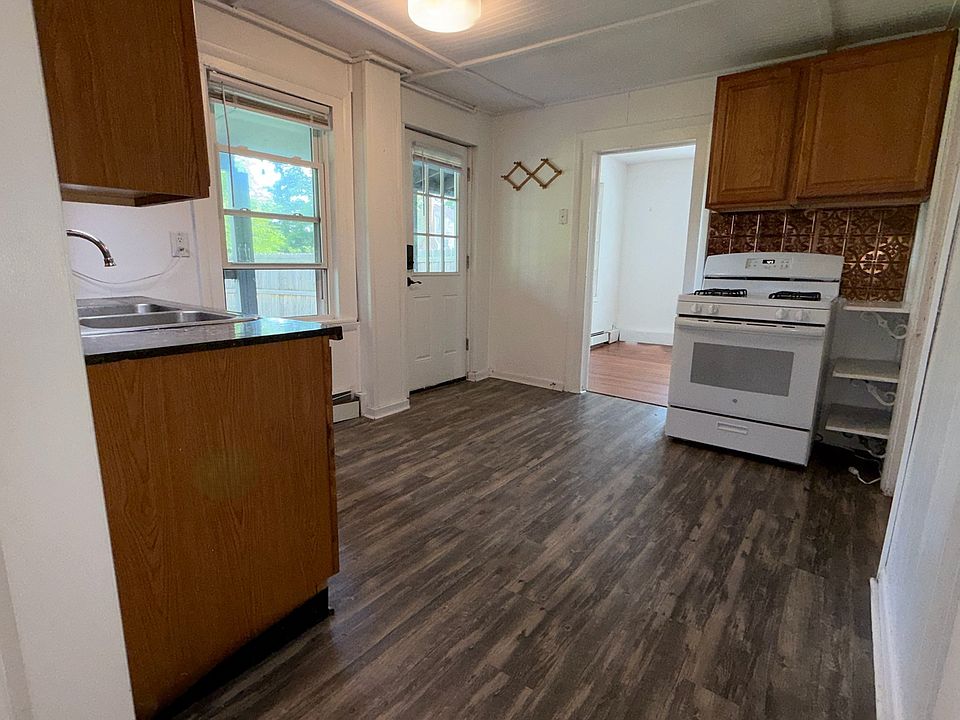 Kitchen with private backyard access, includes washer/dryer