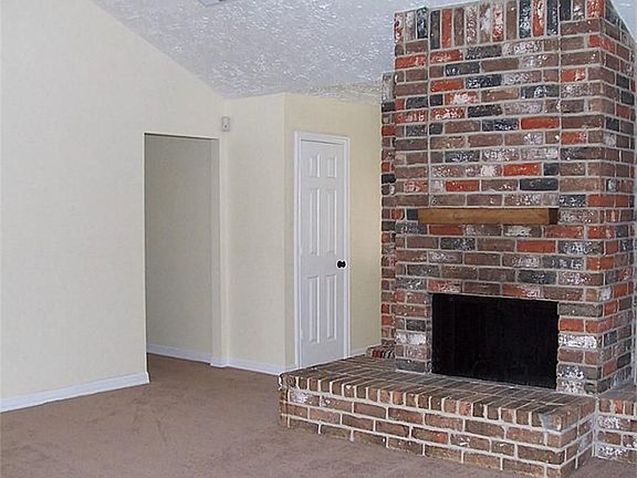 WOOD BURNING FIREPLACE IN THE DEN