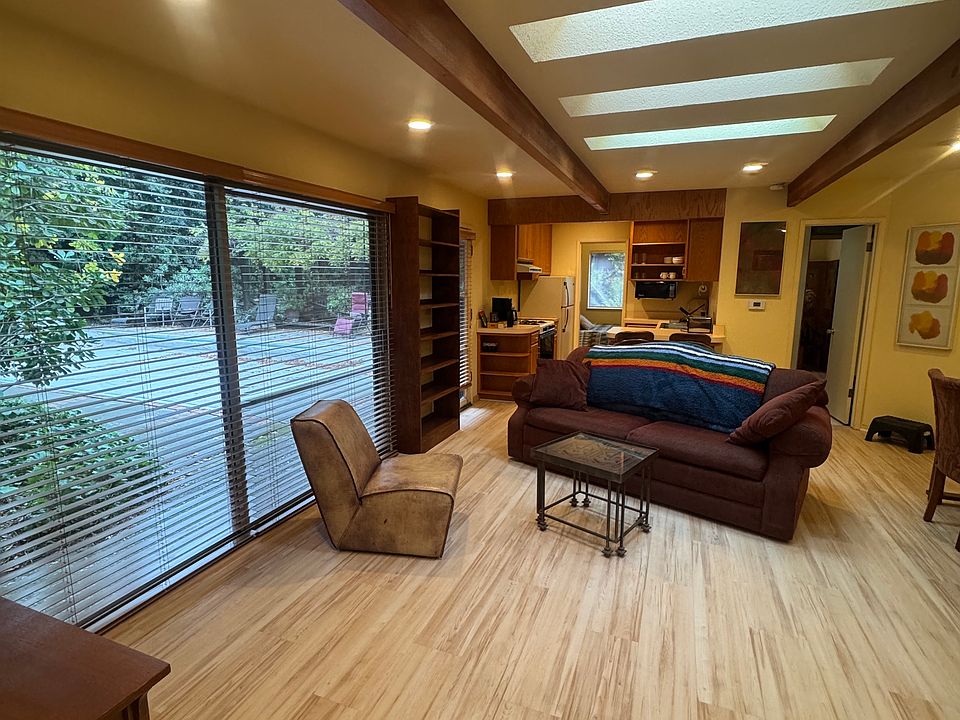 Large living area, showing pool and backyard access