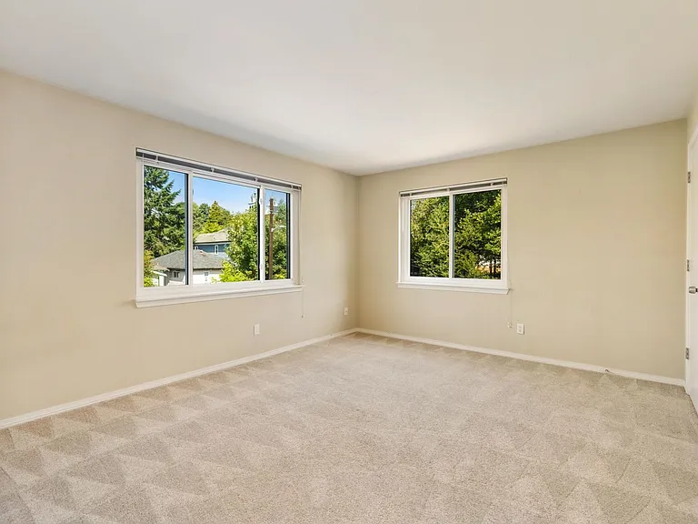 Bedroom #1 with two windows and closet.