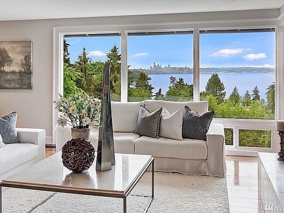 An arboretum-like yard with granite stone paths that lead to secret gardens and beautiful vistas.  A cascading brick fan pattern private drive leads to the front of the home.  Stone pillars with lanterns mark your arrival.  