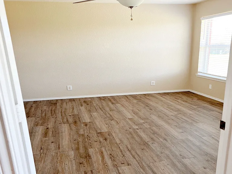Master bedroom with ceiling fan/light.