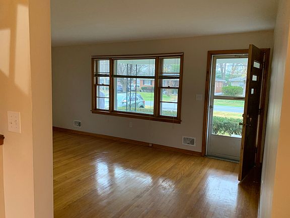 Spacious living room! Beautiful hardwood floors throughout!